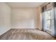 Bedroom featuring carpet floor, light walls, and a window with decorative curtains at 5025 Bishops Row Row, Austell, GA 30106