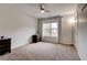Bedroom with carpet flooring, large window, neutral walls, and dark wood dresser at 5025 Bishops Row Row, Austell, GA 30106