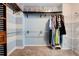 Spacious walk-in closet with ample shelving, hanging racks, and a striped accent wall at 5025 Bishops Row Row, Austell, GA 30106