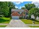 Charming two-story home with a brick facade, manicured lawn, and a convenient two-car garage at 5025 Bishops Row Row, Austell, GA 30106