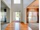 Welcoming foyer with hardwood floors and a view of the front door framed by large windows and curtains at 5025 Bishops Row Row, Austell, GA 30106