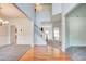Bright and airy foyer with hardwood floors, a staircase, and neutral decor leading into adjacent rooms at 5025 Bishops Row Row, Austell, GA 30106