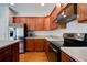Modern kitchen features stainless appliances and dark wood cabinets at 5025 Bishops Row Row, Austell, GA 30106