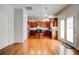 Open kitchen and dining area with stainless appliances, island, and wood cabinets at 5025 Bishops Row Row, Austell, GA 30106