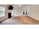 Spacious living room featuring plush carpet, a fireplace, a ceiling fan, and natural light at 5025 Bishops Row Row, Austell, GA 30106