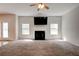 Bright and airy living room with neutral carpet, fireplace, and large windows allowing natural light at 5025 Bishops Row Row, Austell, GA 30106