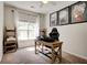 Bright office space with a large window, wooden desk, shelves, and flower art, perfect for a productive work environment at 5025 Bishops Row Row, Austell, GA 30106