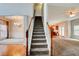 Staircase entry featuring hardwood floors and carpet runner at 5025 Bishops Row Row, Austell, GA 30106