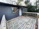 Cozy back porch with classic wood finish, and an exterior view of the home with horizontal siding at 535 Walnut St, Hapeville, GA 30354