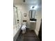 Stylish bathroom featuring a tub with glass door, modern fixtures, and sleek design at 535 Walnut St, Hapeville, GA 30354