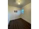 Comfortable bedroom with hardwood floors, a bright window, and neutral paint for a relaxing atmosphere at 535 Walnut St, Hapeville, GA 30354