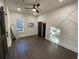 Bright and spacious bedroom with hardwood floors, unique accent wall, and modern lighting at 535 Walnut St, Hapeville, GA 30354