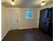 Well-lit dining area showcasing a large window and access to other rooms at 535 Walnut St, Hapeville, GA 30354