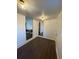 Inviting living room area with hardwood floors, neutral walls, and multiple access points for seamless flow at 535 Walnut St, Hapeville, GA 30354