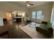 Open-concept living room with hardwood floors, stylish furnishings, and seamless access to the kitchen at 535 Walnut St, Hapeville, GA 30354