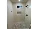 Newly renovated shower with white subway tile, contrasting hexagon tile accents, and modern fixtures at 535 Walnut St, Hapeville, GA 30354