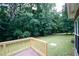 A view from the back deck of the mature trees and large backyard at 555 Flintlock Dr, Dacula, GA 30019