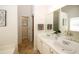 Bathroom featuring a tub, double vanity, and tile floors at 555 Flintlock Dr, Dacula, GA 30019