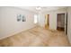 Neutral bedroom with tray ceiling and ensuite bathroom access at 555 Flintlock Dr, Dacula, GA 30019