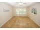 Spacious bedroom features neutral carpet, ceiling fan, and ample natural light at 555 Flintlock Dr, Dacula, GA 30019
