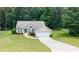 Charming single-story home featuring a well-manicured lawn and inviting curb appeal at 555 Flintlock Dr, Dacula, GA 30019