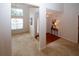 Open-concept room featuring a chandelier and a view to the dining room and foyer at 555 Flintlock Dr, Dacula, GA 30019