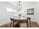 Modern dining room with a round table, four chairs, and wood flooring at 138 Woodlawn Ave, Decatur, GA 30030