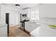Modern kitchen featuring white cabinets, stainless steel appliances, and a breakfast bar at 138 Woodlawn Ave, Decatur, GA 30030