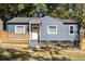 Charming blue home with a cozy front porch and well-maintained landscaping at 205 Maple St, Atlanta, GA 30354