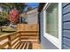 View of cozy front porch with wooden railings and a neighboring house in the background at 205 Maple St, Atlanta, GA 30354
