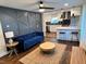 The living room flows into a kitchen, and has dark hardwood floors at 205 Maple St, Atlanta, GA 30354