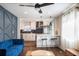 Open concept living space with blue accent wall and kitchen view at 205 Maple St, Atlanta, GA 30354
