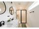 Stylish bathroom with double sinks, sleek fixtures, and a glass-enclosed shower at 3198 Oakdale Rd, Atlanta, GA 30354