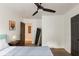This bedroom offers wood floors, a ceiling fan, and an ensuite bathroom for your convenience and comfort at 3198 Oakdale Rd, Atlanta, GA 30354
