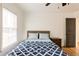 Cozy bedroom bathed in natural light, complemented by wood floors and a comfortable bed at 3198 Oakdale Rd, Atlanta, GA 30354