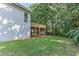 View of the backyard with deck and shed at 4825 Whispering Pine Way, Cumming, GA 30028