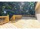 Inviting wooden deck perfect for outdoor entertaining with wooded surroundings at 4825 Whispering Pine Way, Cumming, GA 30028