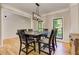 Dining room with hardwood floors, natural light and modern chandelier at 4825 Whispering Pine Way, Cumming, GA 30028