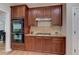Gourmet kitchen featuring stainless steel appliances and granite countertops at 4825 Whispering Pine Way, Cumming, GA 30028