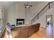 Open-concept living room with fireplace and staircase at 4825 Whispering Pine Way, Cumming, GA 30028