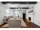 Bright living room features wood floors, fireplace, and ample natural light from large windows at 1045 Moreland Se Ave, Atlanta, GA 30316