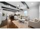 Open-concept living area with hardwood floors, beamed ceilings, and views into the bright kitchen at 1045 Moreland Se Ave, Atlanta, GA 30316