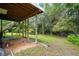 Wooded backyard with staircase to upper level and natural surroundings at 1553 Smithson Ct, Lithonia, GA 30058