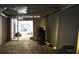 Partially finished basement awaits customization with exposed framing and a peek into another area at 1553 Smithson Ct, Lithonia, GA 30058
