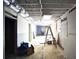 Partially finished basement awaiting completion with exposed ceiling and wall framing at 1553 Smithson Ct, Lithonia, GA 30058