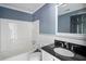 Updated bathroom with modern fixtures, granite counter, and a shower-tub combination at 1553 Smithson Ct, Lithonia, GA 30058