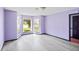 The bedroom is painted a lovely purple color and has great natural light at 1553 Smithson Ct, Lithonia, GA 30058