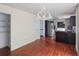 The dining room features hardwood floors and leads into the kitchen area at 1553 Smithson Ct, Lithonia, GA 30058