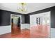 Dining room showcasing hardwood floors, chandelier, and a view to other rooms at 1553 Smithson Ct, Lithonia, GA 30058