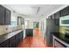 Kitchen with granite countertops, stainless steel appliances, and dark cabinets at 1553 Smithson Ct, Lithonia, GA 30058